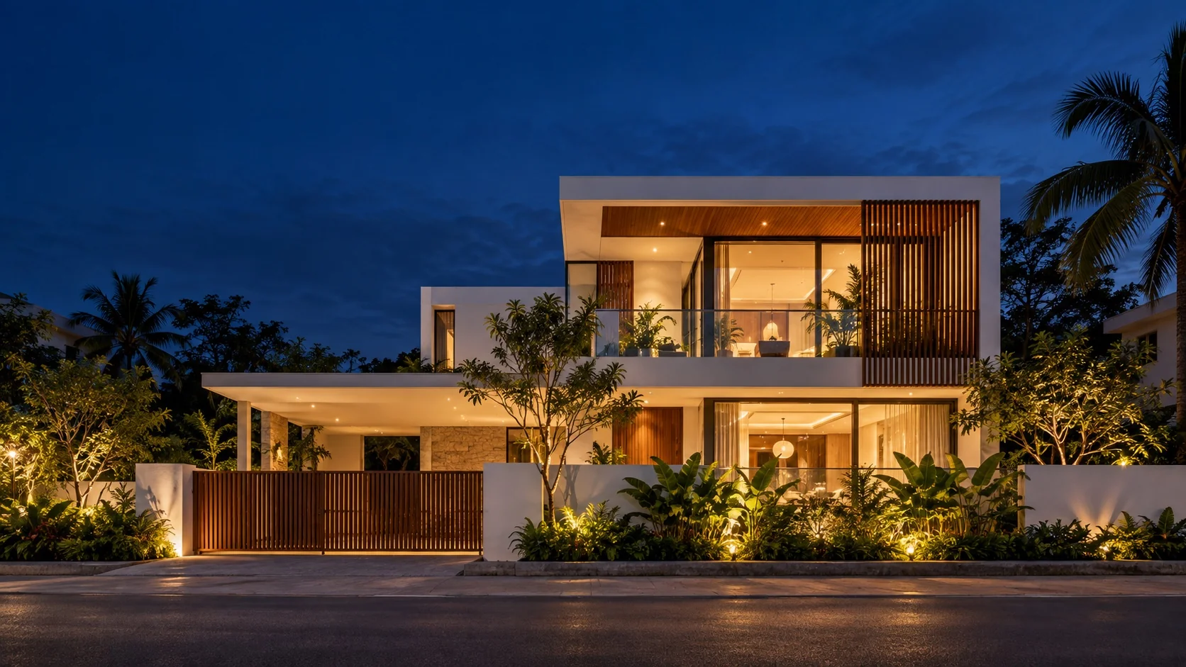 Contemporary Indian residential architecture at blue hour with timber screens and lush tropical landscaping